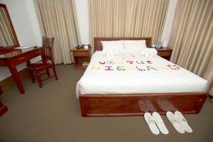 Letto o letti in una camera di Virtue Highland Hotel