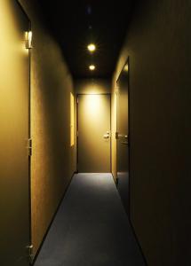 Postel nebo postele na pokoji v ubytování Yumoto Station Hotel MIRAHAKONE