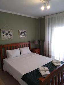 Un pat sau paturi într-o cameră la Family-Elia