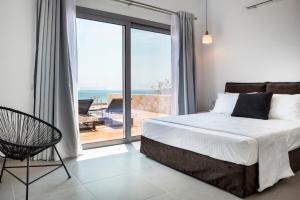Postel nebo postele na pokoji v ubytování Mystique View Villas