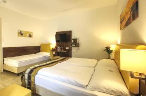 Postel nebo postele na pokoji v ubytování Hotel Rheinfelderhof