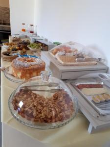 a buffet with many different types of pastries and cakes at Le Mulinare - Bed & Breakfast in Drapia