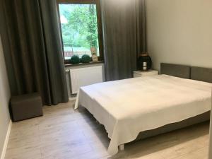 Posteľ alebo postele v izbe v ubytovaní Apartament SONIA