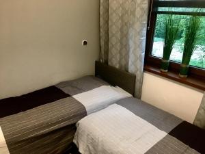 Posteľ alebo postele v izbe v ubytovaní Apartament SONIA