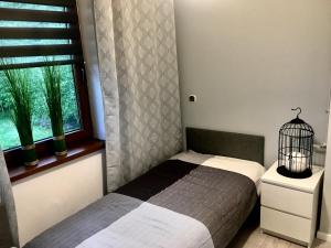 Posteľ alebo postele v izbe v ubytovaní Apartament SONIA