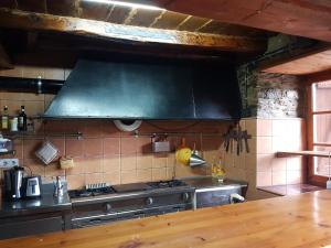 Virtuvė arba virtuvėlė apgyvendinimo įstaigoje Casa Joanet