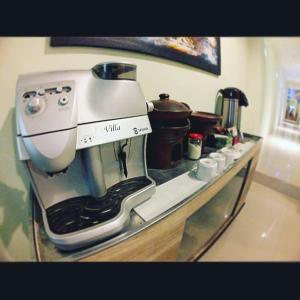 a white mixer sitting on top of a counter at login homestay in Madiun