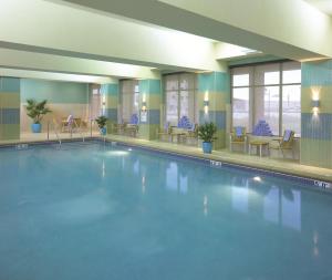 a large swimming pool in a hotel lobby at Hyatt Regency Coralville in Coralville