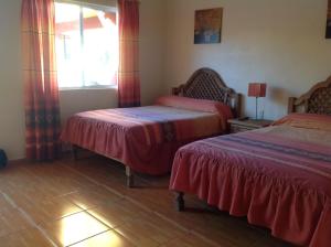 Postel nebo postele na pokoji v ubytování Casona de Cantera