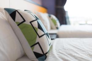 Postel nebo postele na pokoji v ubytování Pon Pon Wu Homestay