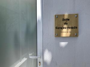 a sign on a door that reads suite do grand rapids at A Villa by the Sea Bed & Breakfast in Vila Franca do Campo