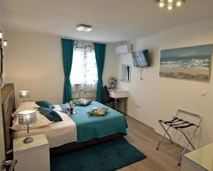 Posteľ alebo postele v izbe v ubytovaní Kuzma Rooms and Apartments