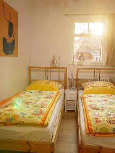 Кровать или кровати в номере Ferienwohnung Berlin