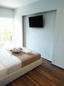 A bed or beds in a room at Limonchello
