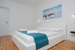 Posteľ alebo postele v izbe v ubytovaní Besker Apartment