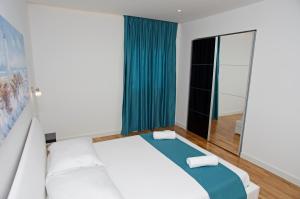 Posteľ alebo postele v izbe v ubytovaní Besker Apartment