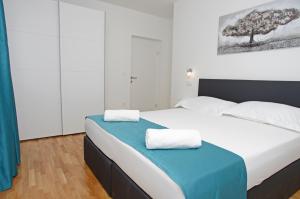 Posteľ alebo postele v izbe v ubytovaní Besker Apartment