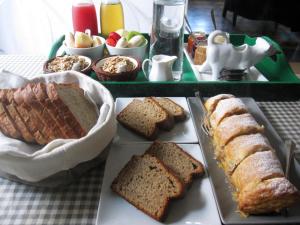 a table with different types of bread and fruit at Brancadoria B&B in Monteleone Rocca Doria
