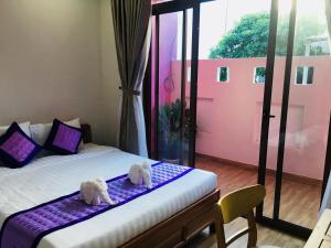 Postel nebo postele na pokoji v ubytování Ms Tri Homestay