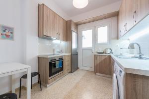 A kitchen or kitchenette at Stylish Athenian Flat