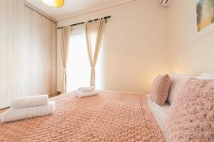 A bed or beds in a room at Stylish Athenian Flat