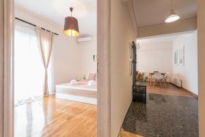 A bed or beds in a room at Stylish Athenian Flat
