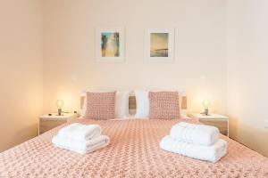 A bed or beds in a room at Stylish Athenian Flat