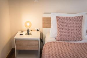 A bed or beds in a room at Stylish Athenian Flat