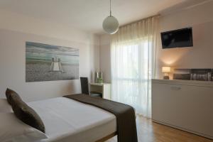 Postel nebo postele na pokoji v ubytování Vialeromadodici Rooms & Apartments + 37 fotografií
