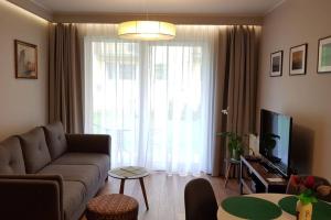Televízia a/alebo spoločenská miestnosť v ubytovaní New apartment 100m from old town and marina + 22 fotografií