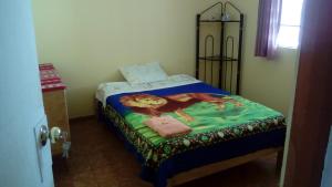 Ліжко або ліжка в номері Hospedaje Casa Viru