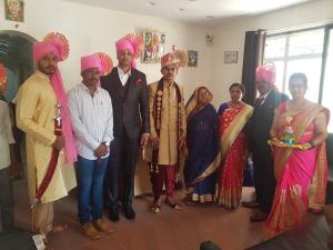 a group of people posing for a picture in a room at Godavari Lodge in Solapur