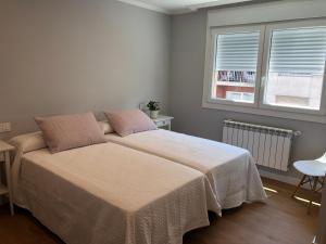 Ein Bett oder Betten in einem Zimmer der Unterkunft Apt Moderno céntrico y soleado
