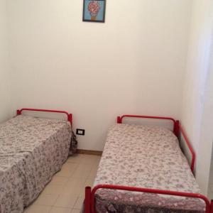 Katil atau katil-katil dalam bilik di Appartamento in residence Laghi di Sibari
