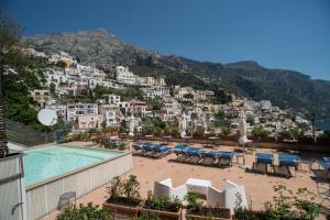 a view of a resort with a pool and buildings at Hotel Posa Posa in Positano
