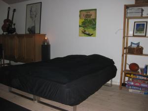 Giường trong phòng chung tại Ved Vandet
