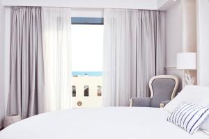 Voodi või voodid majutusasutuse Lagos Mare Hotel toas