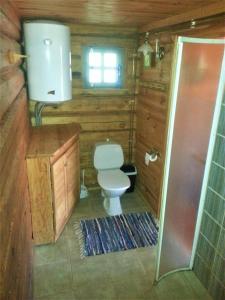 a small bathroom with a toilet and a sink at Saulepa Cottage in Saulepa