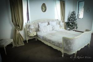 เตียงในห้องที่ Pensiunea Vlahia Inn