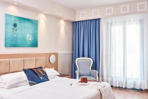 Voodi või voodid majutusasutuse Lagos Mare Hotel toas