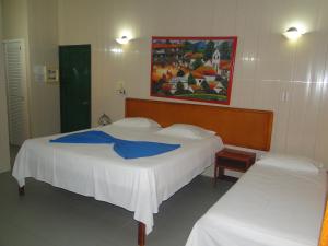 Postel nebo postele na pokoji v ubytování Hotel Nitana