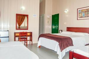 Postel nebo postele na pokoji v ubytování Hotel Nitana