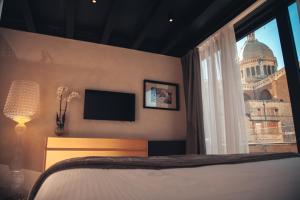 Postel nebo postele na pokoji v ubytování Alba Palace Hotel