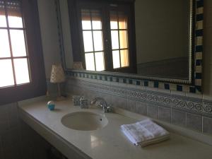 a bathroom with a sink and a mirror at O Candil De Santa Ana in Pontevedra +75 photos