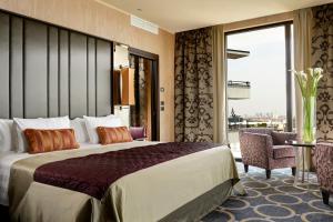A bed or beds in a room at Uptown Palace