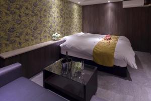 Voodi või voodid majutusasutuse ホテルオリジン Hotel Origin 男塾ホテルグループ toas