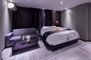 Voodi või voodid majutusasutuse ホテルオリジン Hotel Origin 男塾ホテルグループ toas