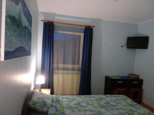 Una cama o camas en una habitación de Anette House