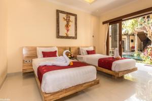 Postel nebo postele na pokoji v ubytování Bliss Ubud Abangan