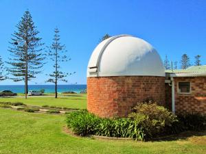 a brick building with a dome on top of it at Ocean Court 8 13 Lord Street in Port Macquarie